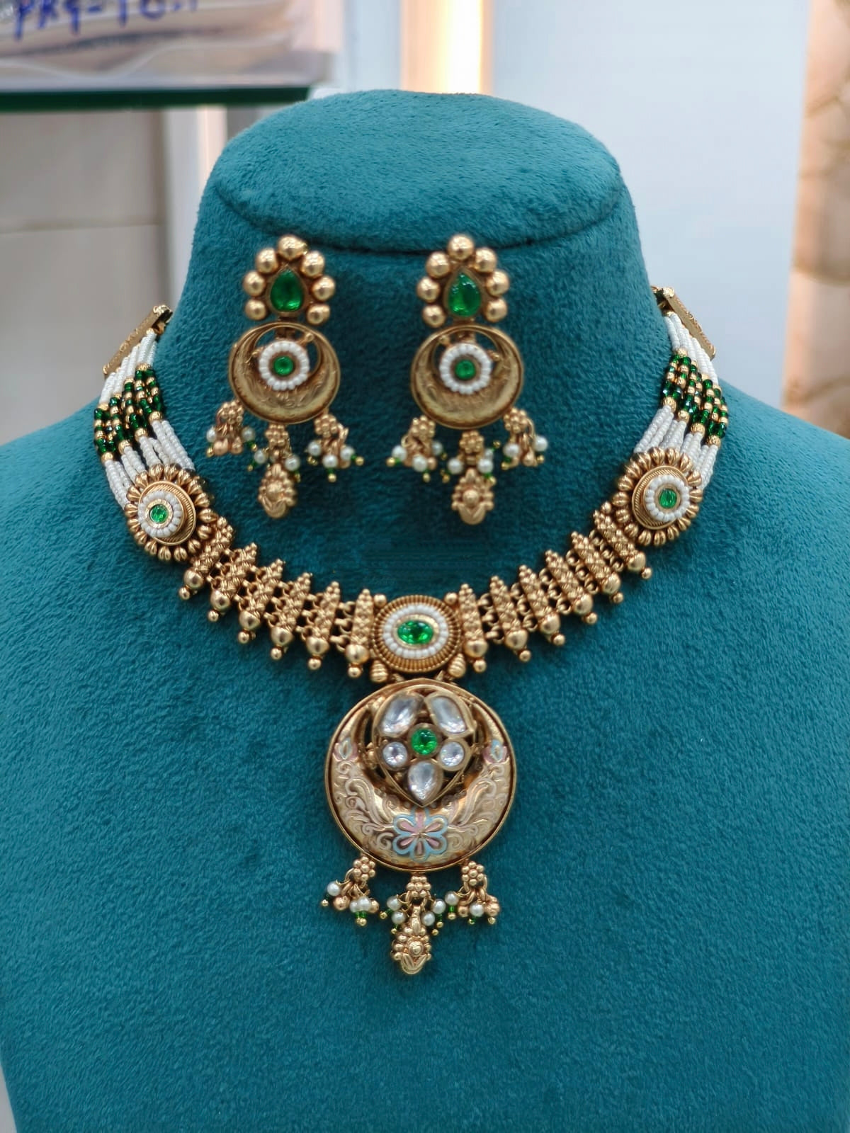 Traditional Gold Necklace Set with Green Accents & Jhumkas