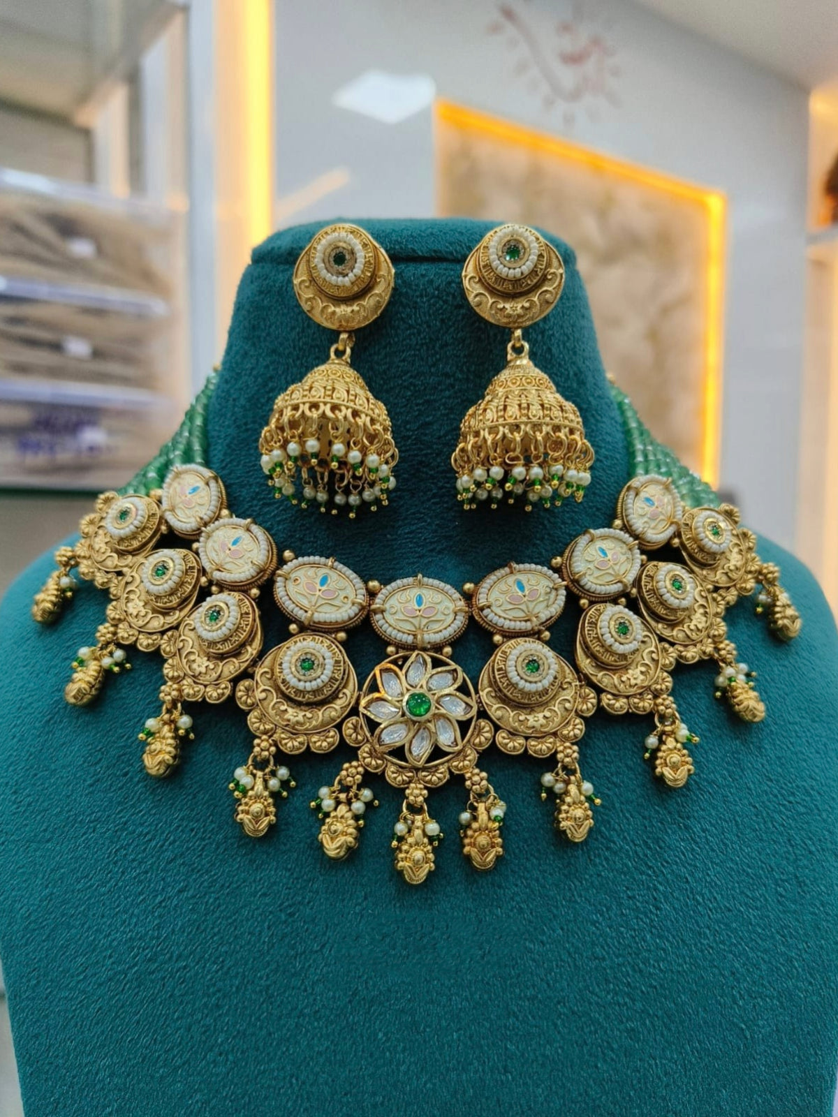 Gold Choker Set with Kundan, Green Stone, and Pearl Accents